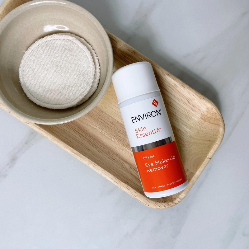 Environ Oil-Free Eye Make-Up Remover in a clear bottle with a white cap, designed for gentle eye makeup removal.