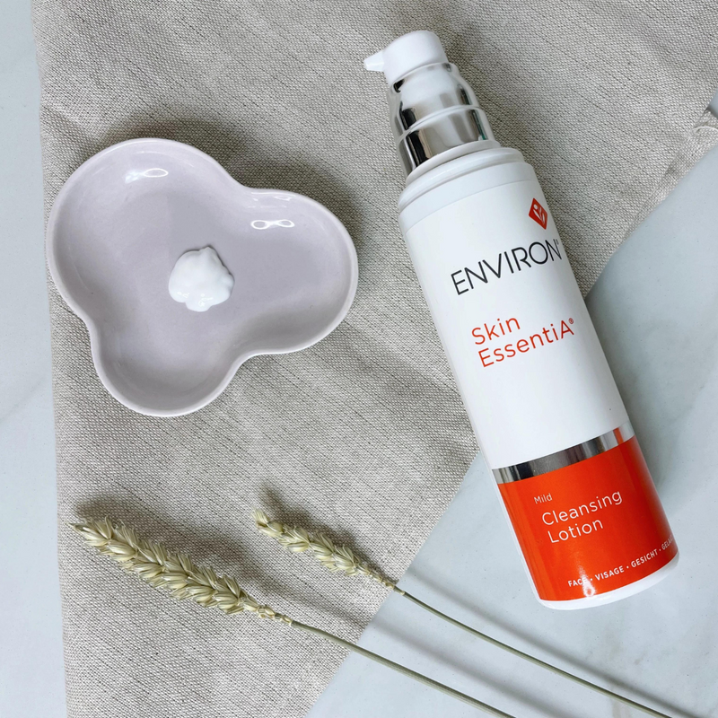 Environ Mild Cleansing Lotion bottle with clear label, white cap, and product details visible, designed for gentle facial cleansing.