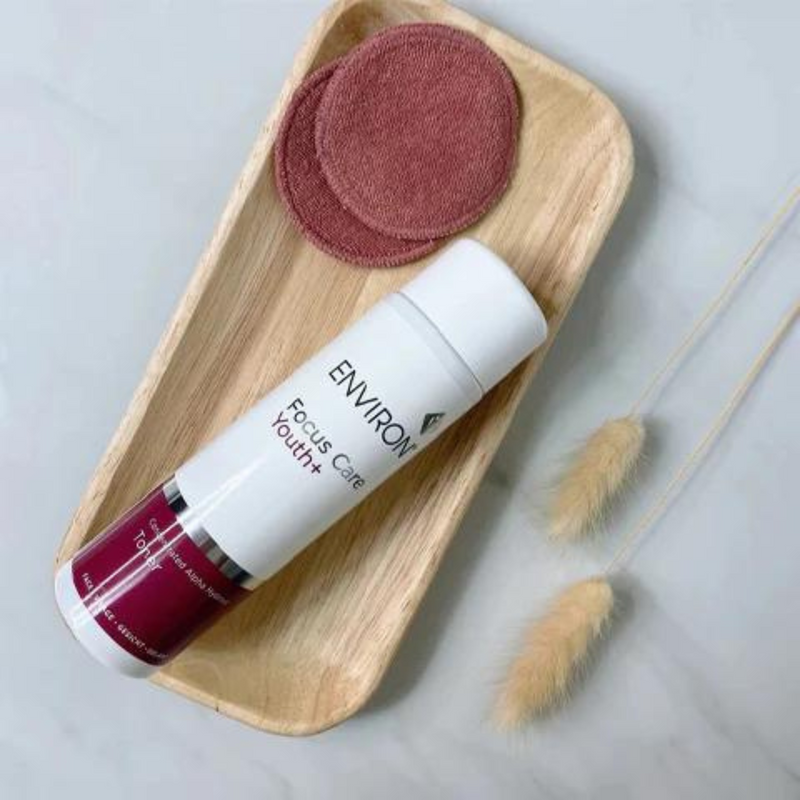 Environ Concentrated Alpha Hydroxy Toner bottle with clear liquid and label, used for facial skin exfoliation and renewal
