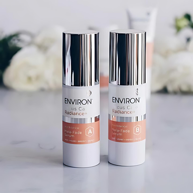 Environ Vita-Botanical Mela-Fade Serum System A+B bottles with labels, featuring white and purple packaging.